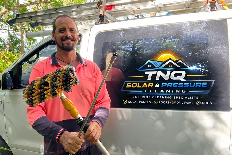 Owner of TNQ Exterior Cleaning with branded work vehicle in Cairns